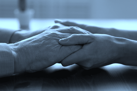 old hands being held by young hands